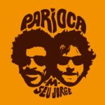 Parioca est un duo entre Matthieu Chedid et Seu Jorge. Commencé il y a 12 ans au Brésil à la suite du Festival Encantado où ils se produisirent ensemble et du show de nouvel an de Seu Jorge sur la plage de Copacabana où il convia son ami français. Juste retour des choses après que Matthieu eut invité Jorge à Bercy en 2004. Finalisé ses dernières semaines, ce duo est réalisé par Jérôme Pigeon, producteur du disque « Cru » de Seu Jorge et ami de Matthieu qui les présenta l’un à l’autre à la fin des années 90. Il s’agit d’un hymne à l’amitié intercontinentale qu’entretiennent les deux musiciens qui évoquent leur relation toujours joyeuse, chaleureuse et féconde. Seu Jorge sera au Grand Rex le 1er Avril 2025 en concert exclusif !